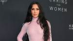 Kim Kardashian Shows off Abs and Sideboob in Bikini ·